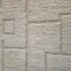Close-up of carved squares in the all-ivory wool pile