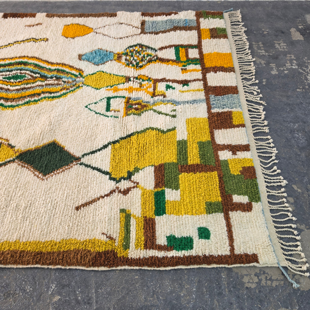 Close-up of Moroccan Boujad rug corner with colorful geometric block pattern and fringe