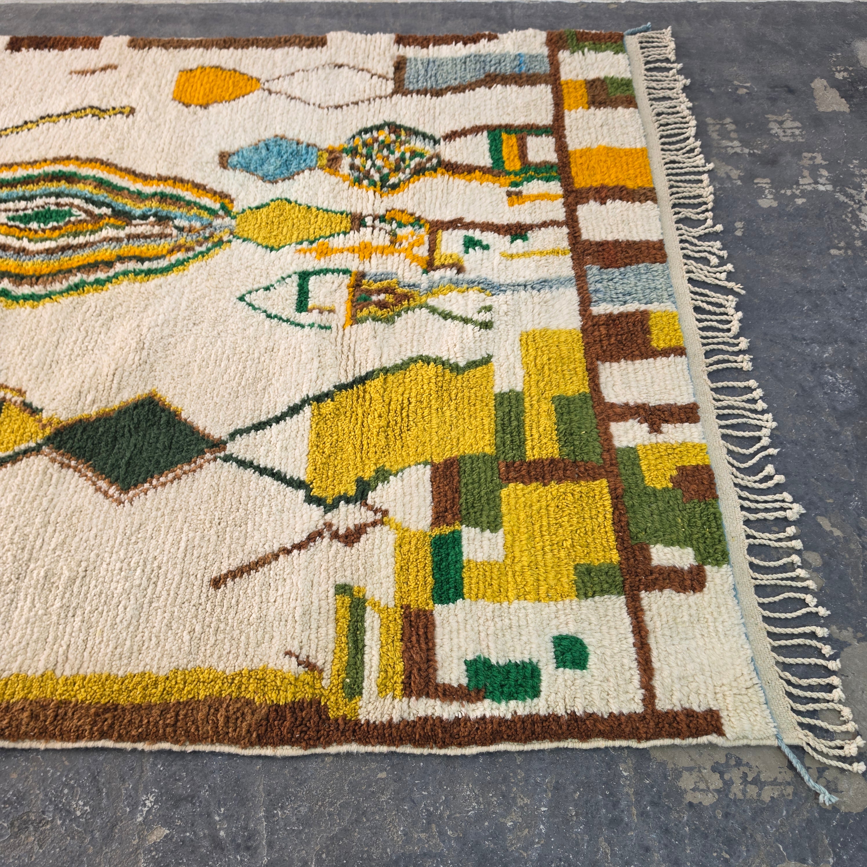 Close-up of Moroccan Boujad rug corner with colorful geometric block pattern and fringe